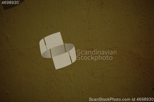 Image of Old grungy ochre colored wall background texture