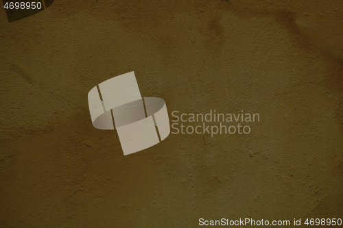 Image of Weathered stained ochre wall background texture