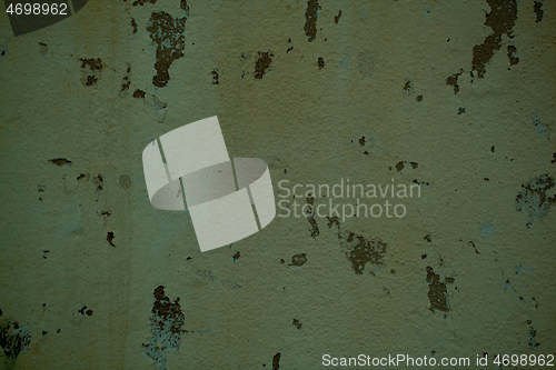 Image of Grunge off white stained wall with flaky paint