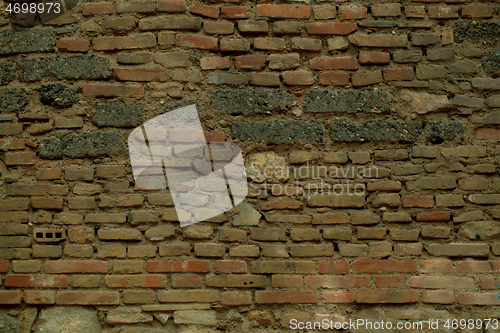 Image of Old weathered irregular brick wall texture