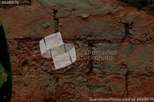 Image of Close up detail of old weathered red bricks