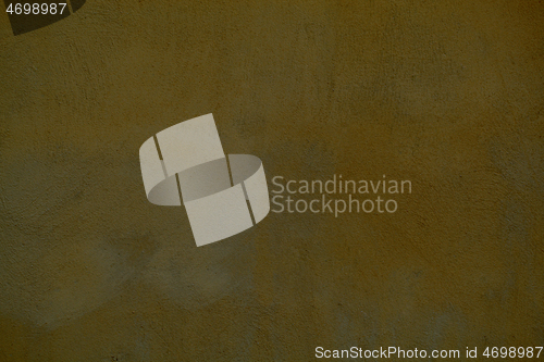 Image of Dingy dark ochre painted wall background texture