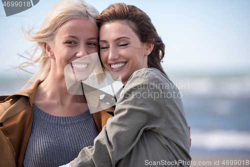 Image of Women Smiling And Enjoying Life at Beach