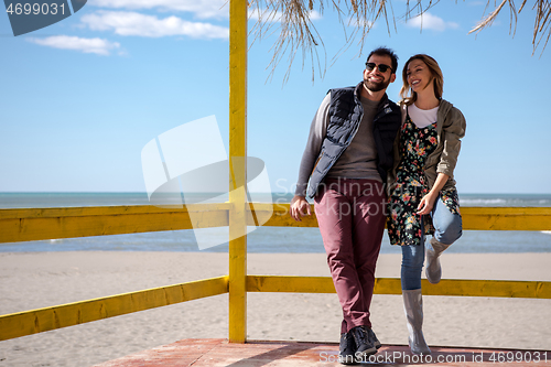 Image of Couple chating and having fun at beach bar