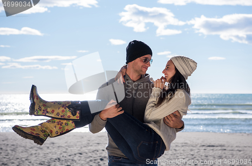 Image of Couple chating and having fun at beach bar