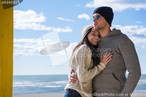 Image of Couple chating and having fun at beach bar