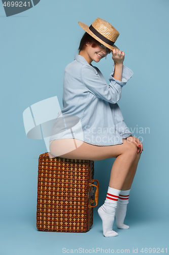 Image of Young beautiful pregnant woman posing on blue background