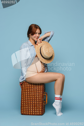Image of Young beautiful pregnant woman posing on blue background