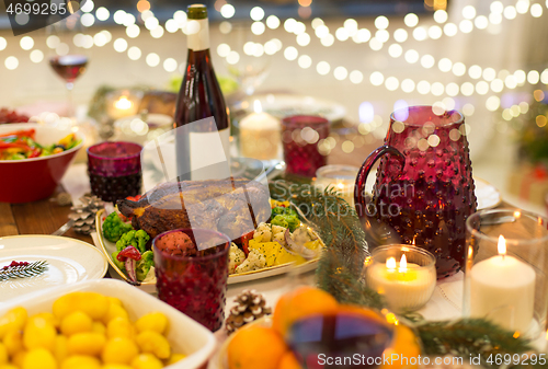 Image of food and drinks on christmas table at home