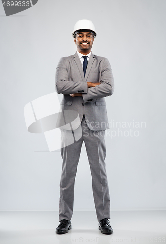 Image of indian male architect in helmet over grey