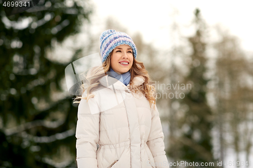 Image of happy smiling woman outdoors in winter