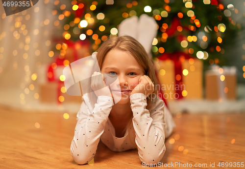 Image of smiling girl at christmas home