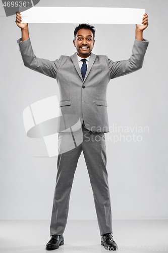Image of happy indian businessman with white banner
