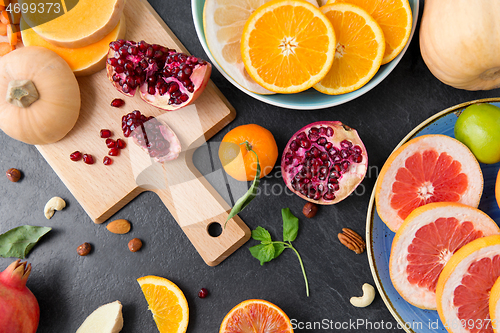 Image of different vegetables and fruits on on slate table