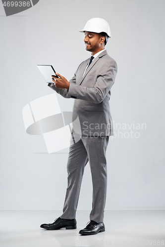 Image of indian architect in helmet with tablet computer