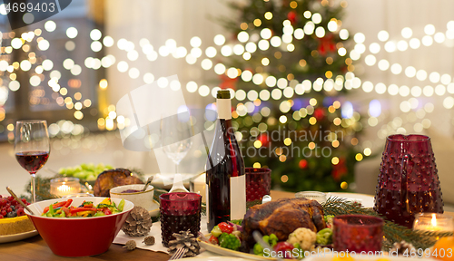 Image of food and drinks on christmas table at home