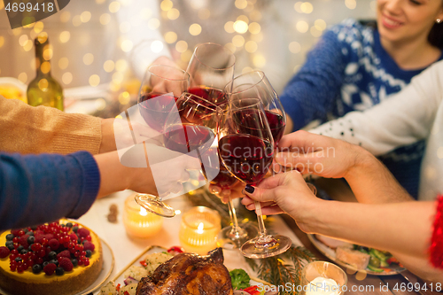 Image of close up of friends with wine celebrate christmas