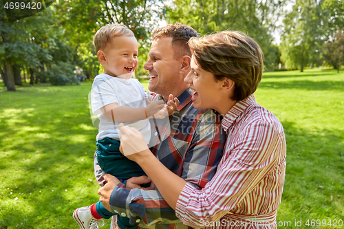 Image of happy family at summer park