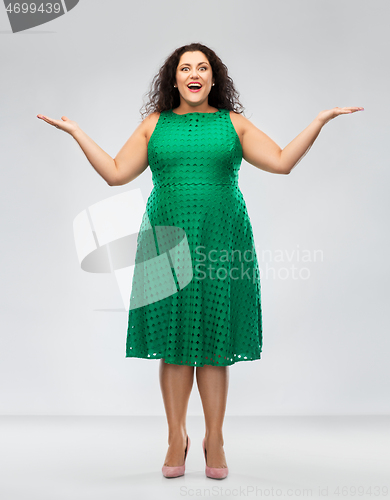 Image of happy smiling woman in green dress