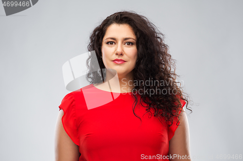 Image of woman in red dress over grey background