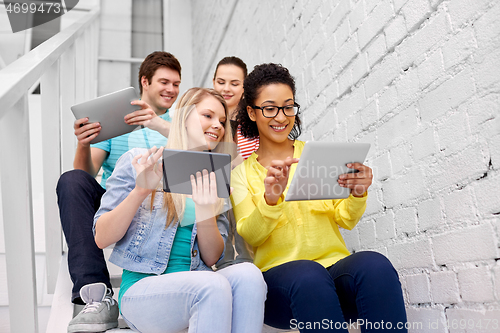 Image of high school students with tablet computers