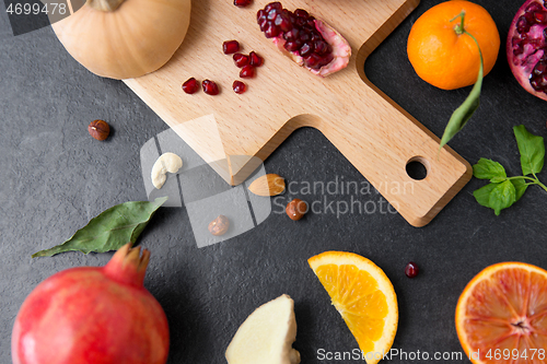 Image of different vegetables and fruits on on slate table