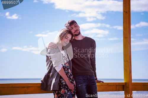 Image of Couple chating and having fun at beach bar