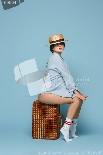 Image of Young beautiful pregnant woman posing on blue background