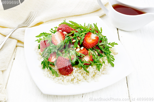 Image of Salad of strawberry and couscous on wooden board