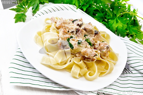 Image of Pasta with salmon in cream on board