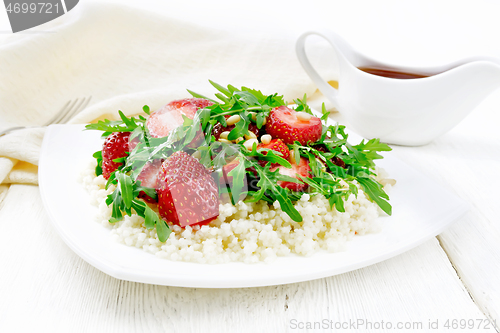 Image of Salad of strawberry and couscous on light board