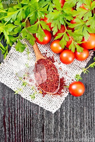 Image of Tomatoes dried in spoon on dark board top