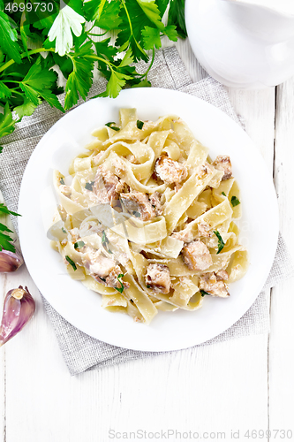 Image of Pasta with salmon and cream on light board top