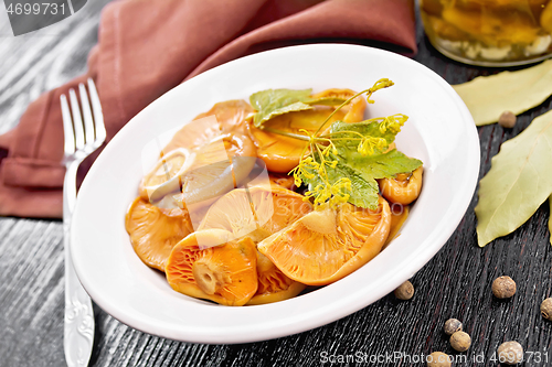 Image of Mushrooms salted in plate on board