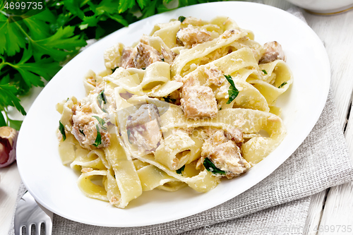 Image of Pasta with salmon and cream on white board