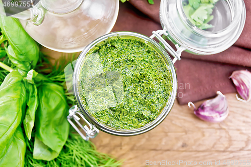 Image of Sauce of spicy greens in jar on board top