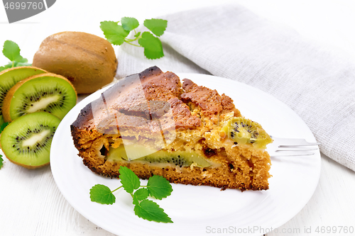 Image of Pie with kiwi in plate on board