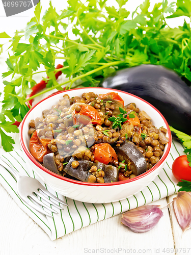 Image of Lentils with eggplant in bowl on towel