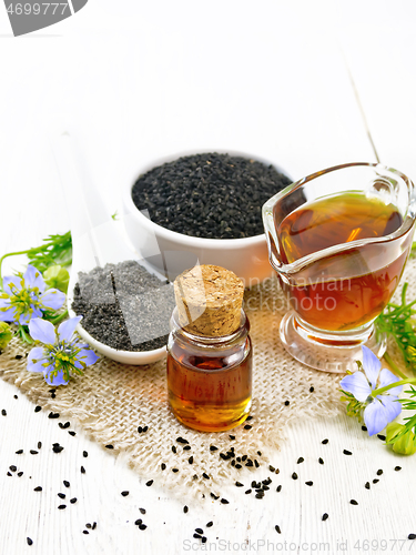 Image of Oil kalingi in bottle and gravy boat on board