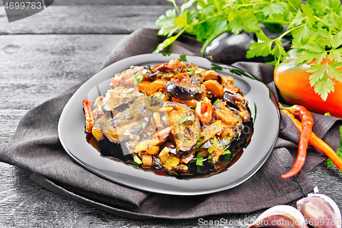 Image of Ragout with eggplant and pepper on dark board