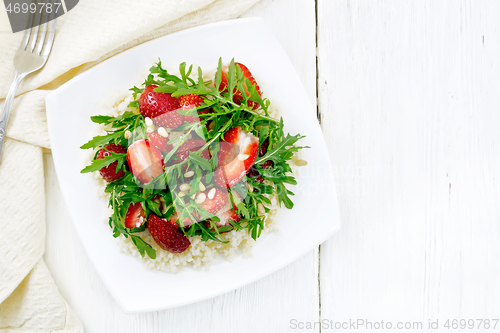 Image of Salad of strawberry and couscous on light board top