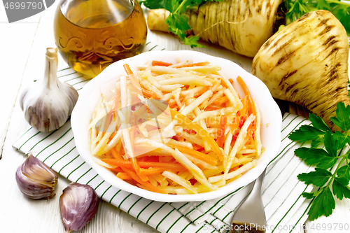 Image of Salad of parsnip and carrot on napkin