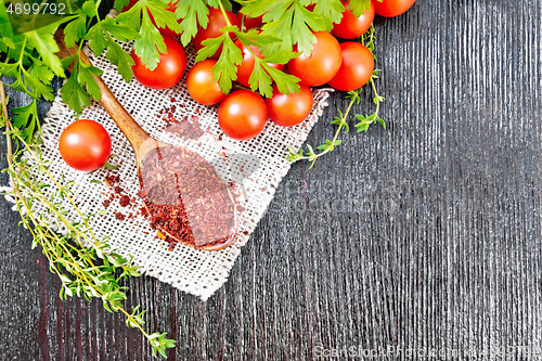 Image of Tomatoes dried in spoon on black board top