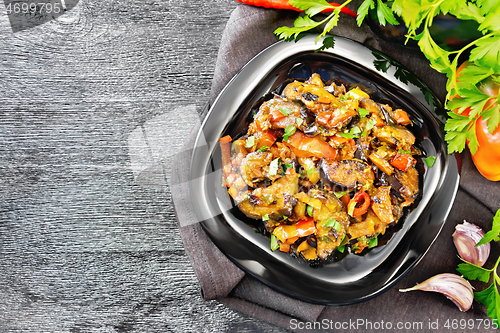 Image of Ragout with eggplant and pepper on black board top