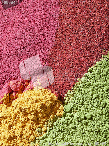 Image of various colorful dried fruit powder