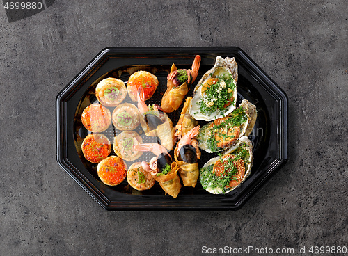 Image of plate of various seafood snacks