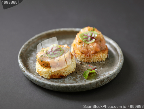 Image of toasted bread with salmon tartar