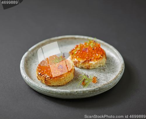 Image of toasted bread with red caviar