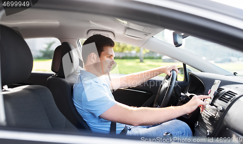 Image of man or driver driving car and using gps navigator