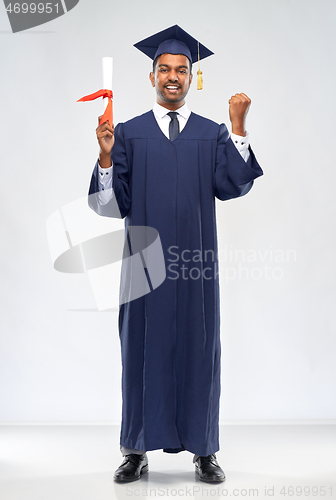 Image of happy graduate student in mortarboard with diploma